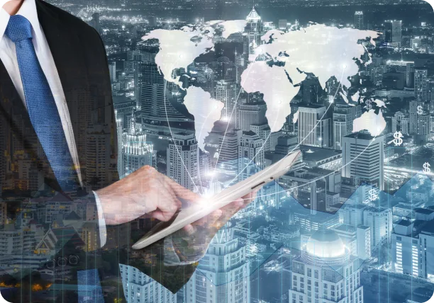 A businessman with a tablet in front of a world map over a city